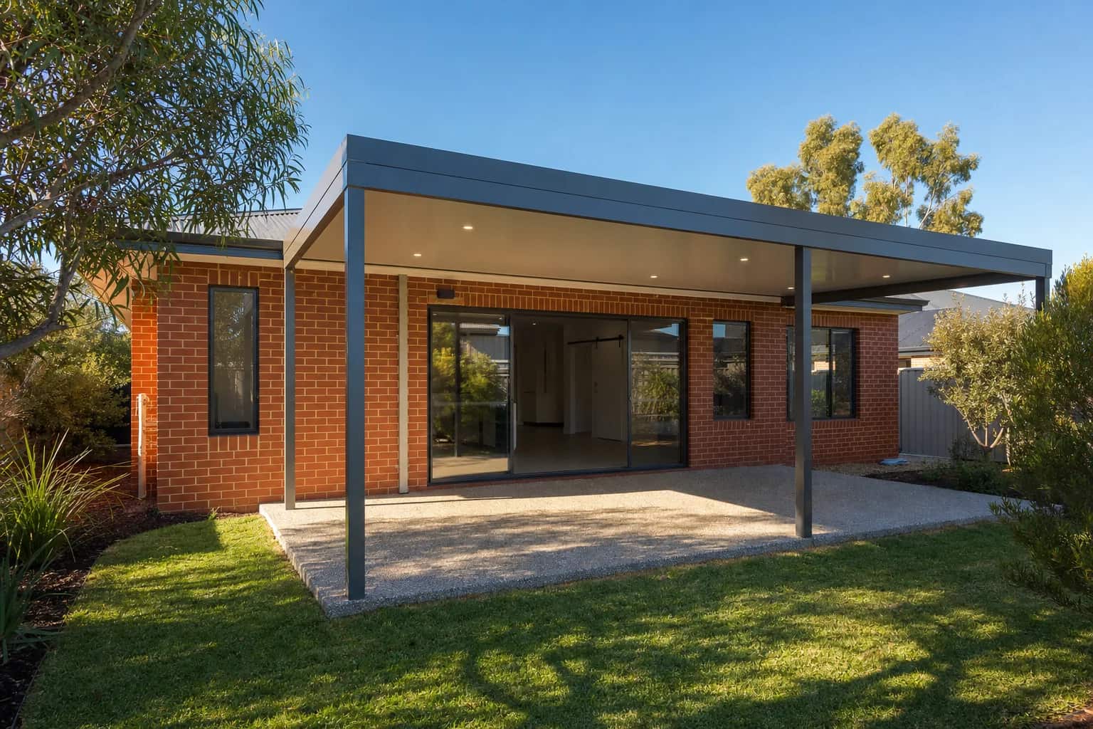 A flat roof Colorbond patio attached to the rear of a Perth home, built within standard setbacks