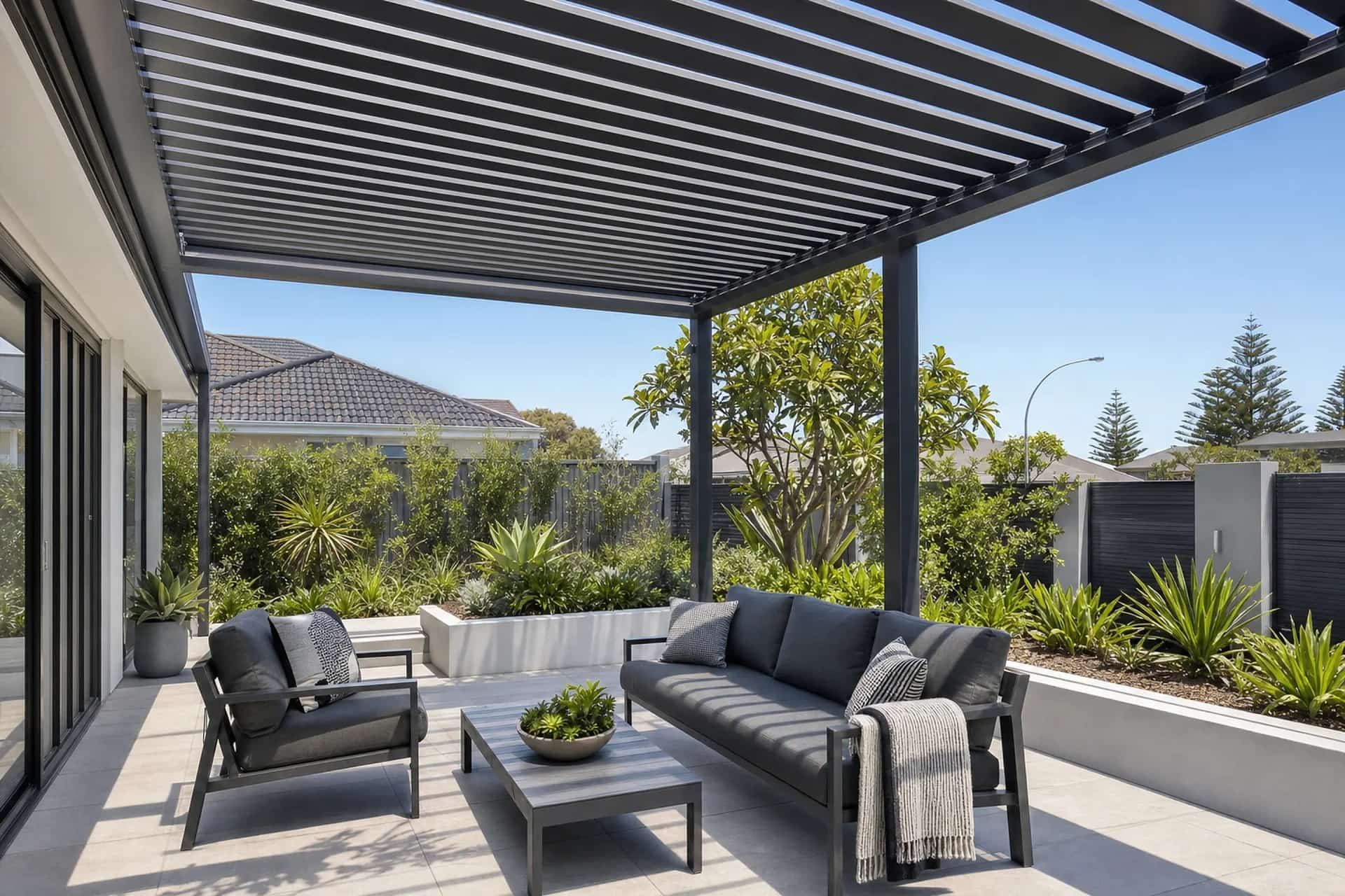 Open slatted aluminium pergola over an outdoor lounge in Joondalup